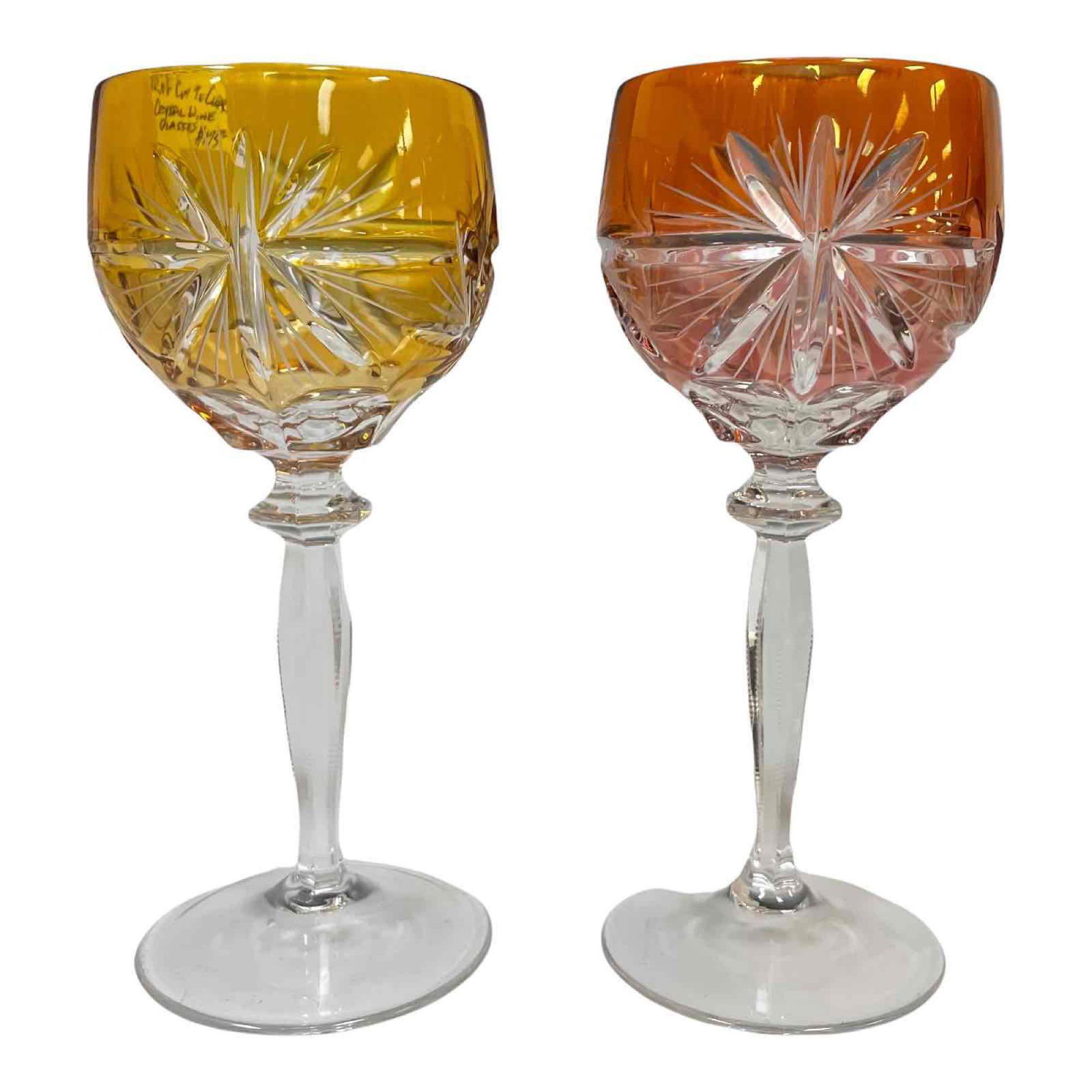 Two (2) Color to Cut Crystal Toasting Glasses: Two elegant color cut to clear white wine zipper cut stems. One canary yellow to clear and one fire orange to clear. Bohemian or Czech art glass, c. 20th century. Excellent condition commensurate with