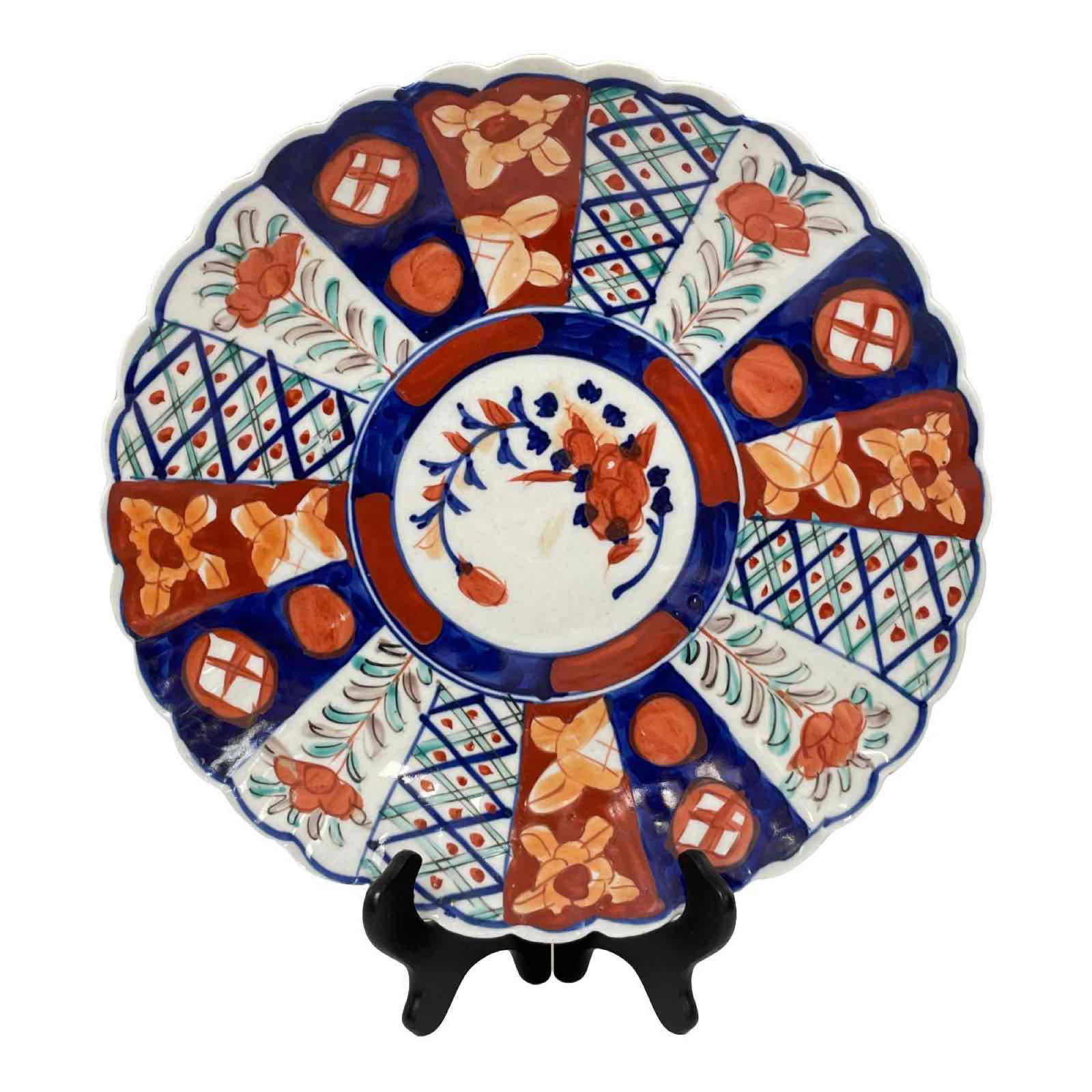 Imari Porcelain Charger: Hand-painted Imari Porcelain Charger with decoration on both sides. Condition with appropriate signs of age, wear, and use, see photos for details. Approx 11" diameter.