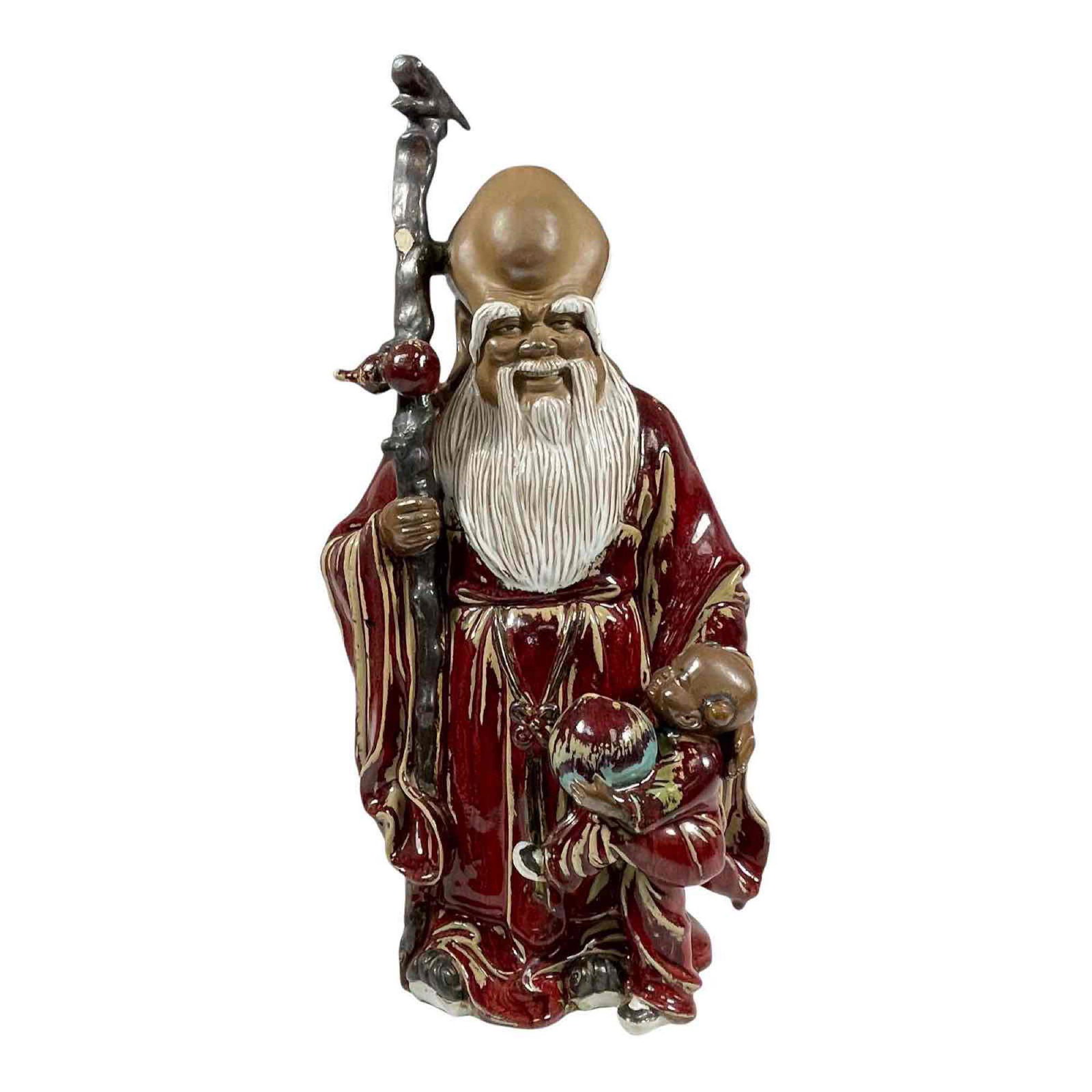 Ceramic Immortal Figure: An Asian ceramic statue of an Immortal. Condition commensurate with age and use; please see photos for details. Approx. 19 3/4" h.