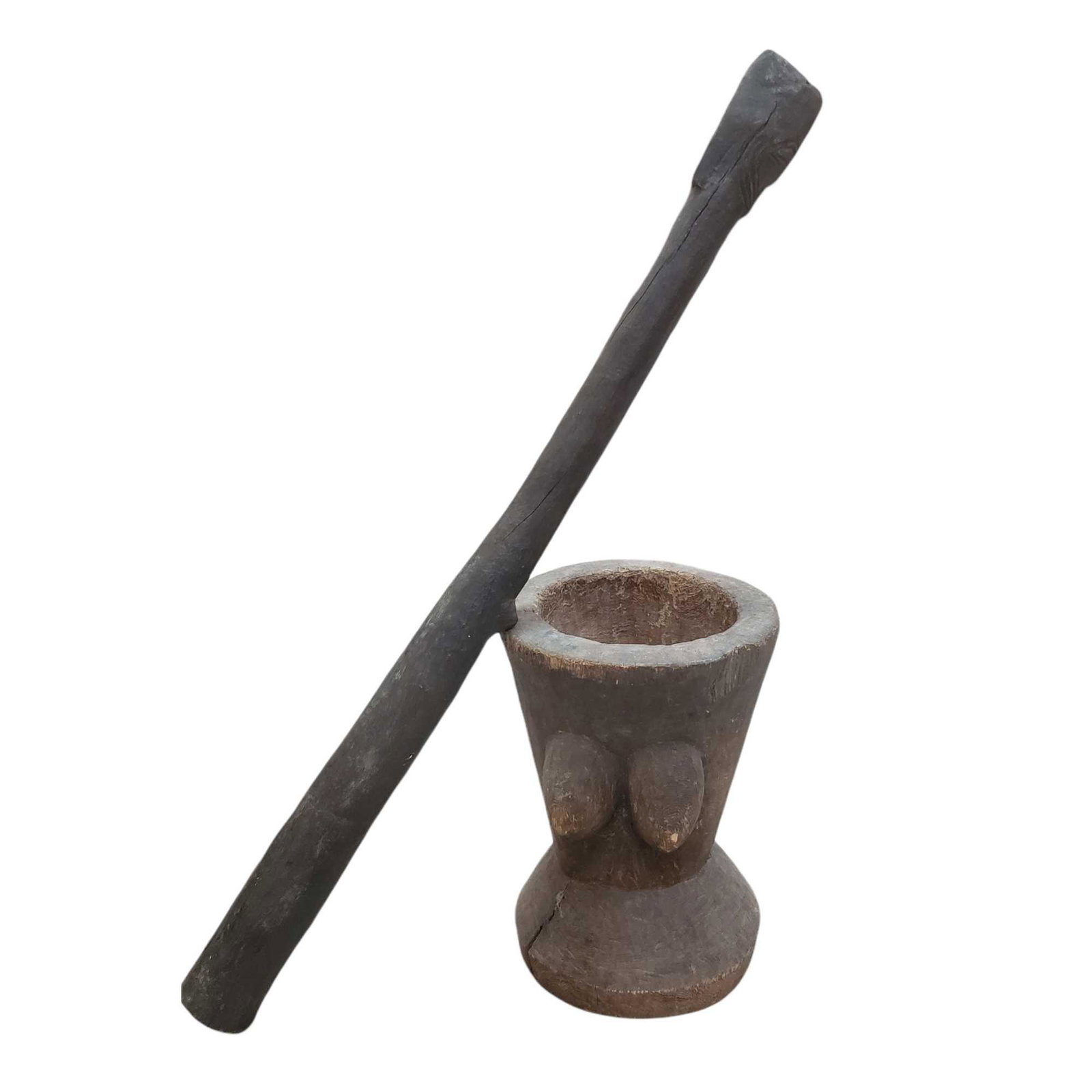 Oversized Mortar and Pestle East African: East African oversized traditional mortar and pestle. Mortar measuring approx. 15" tall with beast on one side and pestle measuring approx. 40" tall with face carved on top and pair of breast midway d