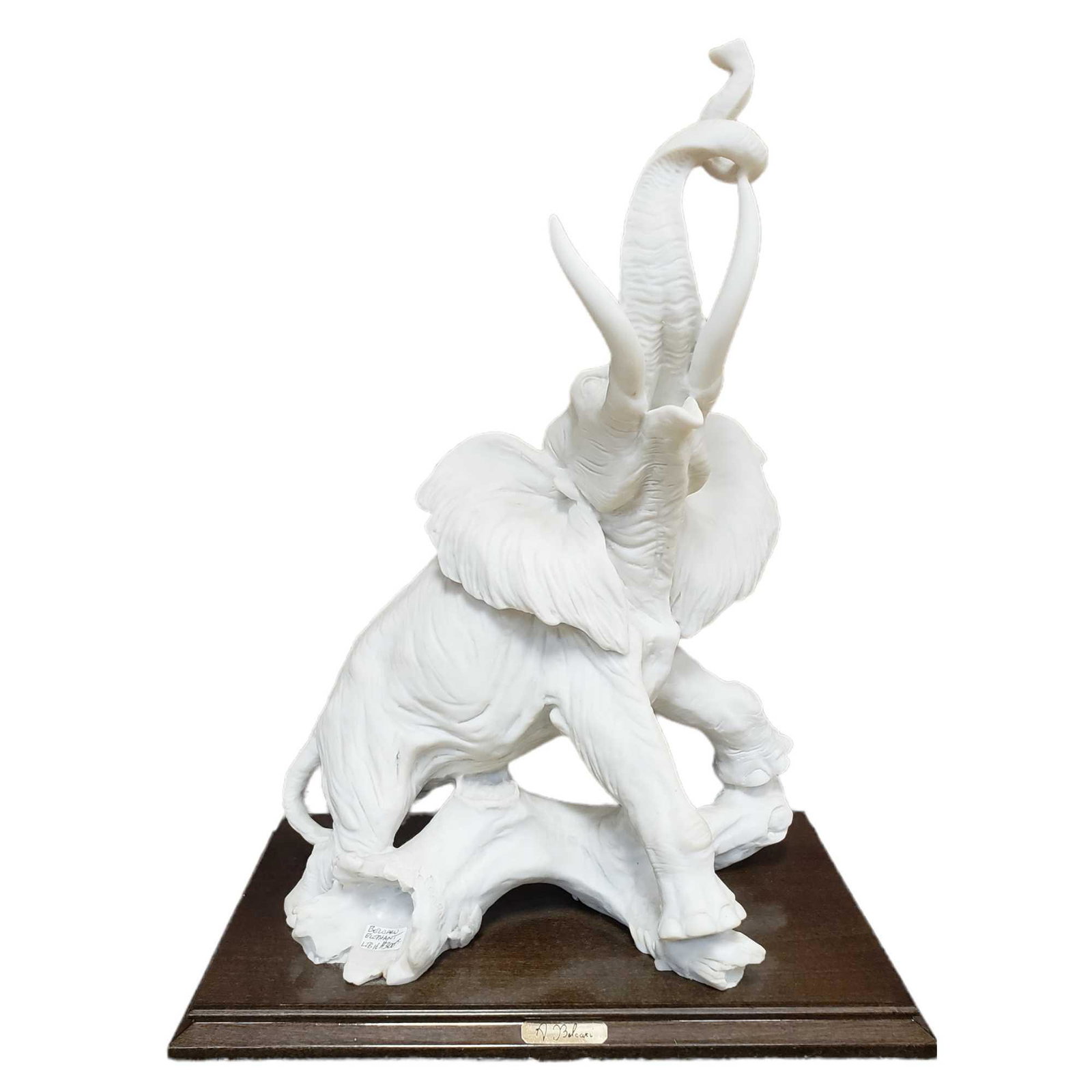 Auro Belcari Alabaster Elephant Sculpture: Artist signed Auro Belcari Italian alabaster dramatic elephant sculpture. Measuring approx. 16" tall x 12.5" base x 8" deep. In good condition, see photos.