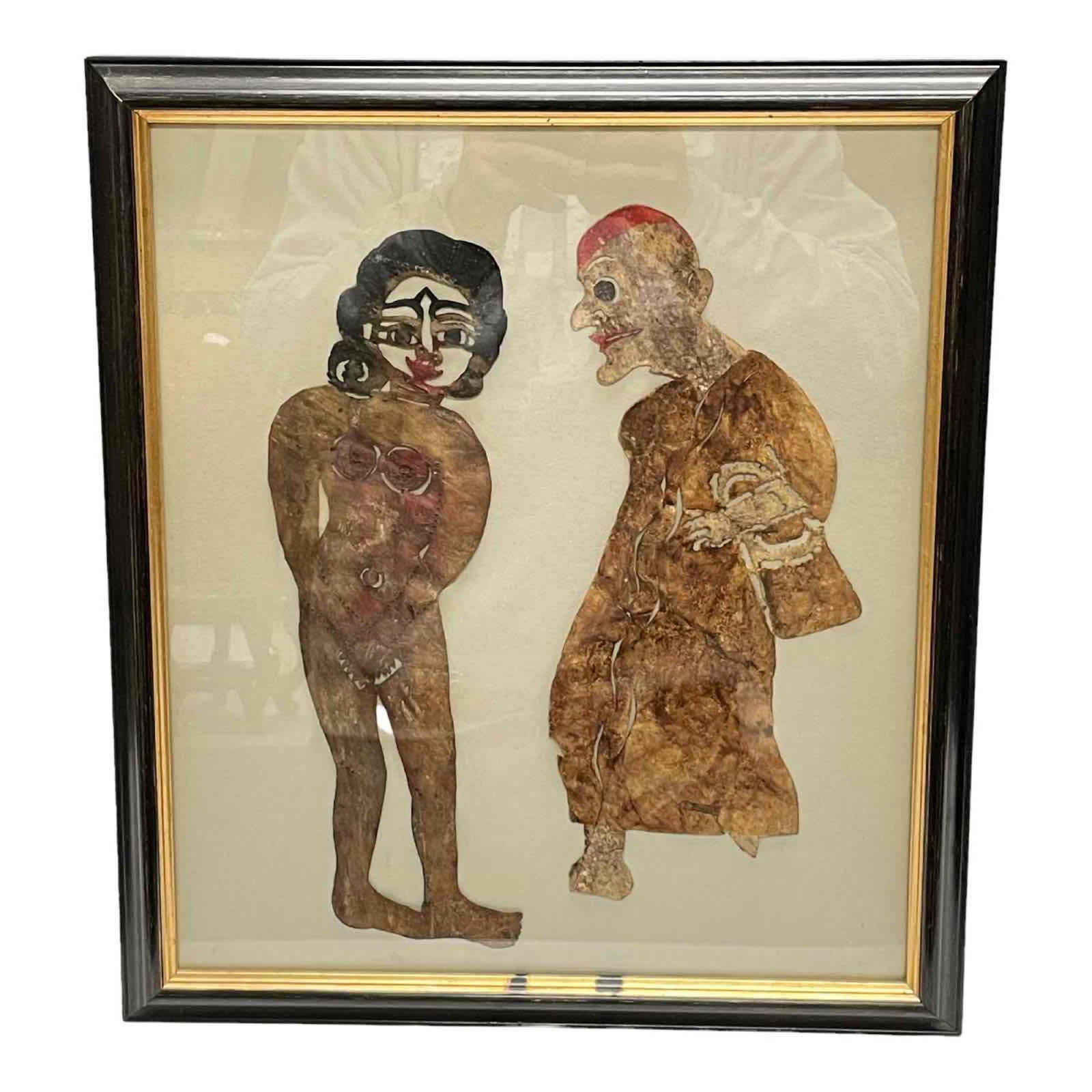 Framed Animal Skin Art of Figural Silhouettes: Two tribal or western civilized people cut and made from what appears to be animal hide or skin and frame into art as shown. not examined out of the glass/frame. No found signatures, see photos for de