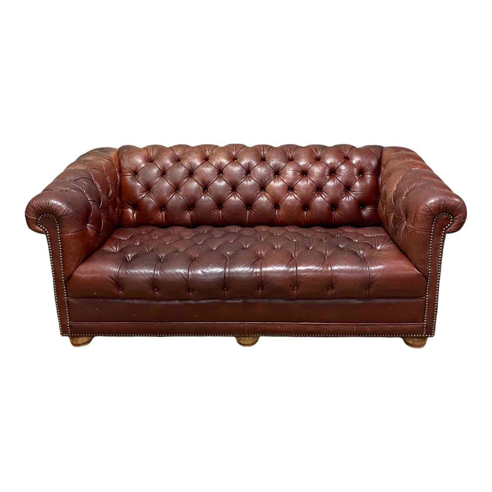 Chesterfield Button Tufted Leather Love Seat: Sun fading and dry cracks. 29" tall x 68" long x 33.5" deep.