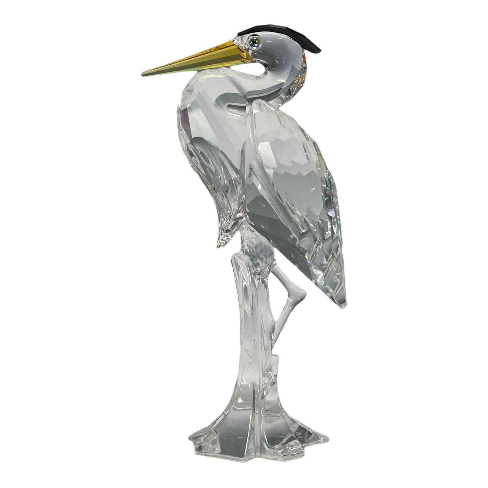 Swarovski Crystal Crane or Heron Bird: Swarovski crystal crane or heron bird figurine. Having golden beak with black head dress. Measuring approx. 6" tall. In excellent condition with no chips or breaks, see photos.