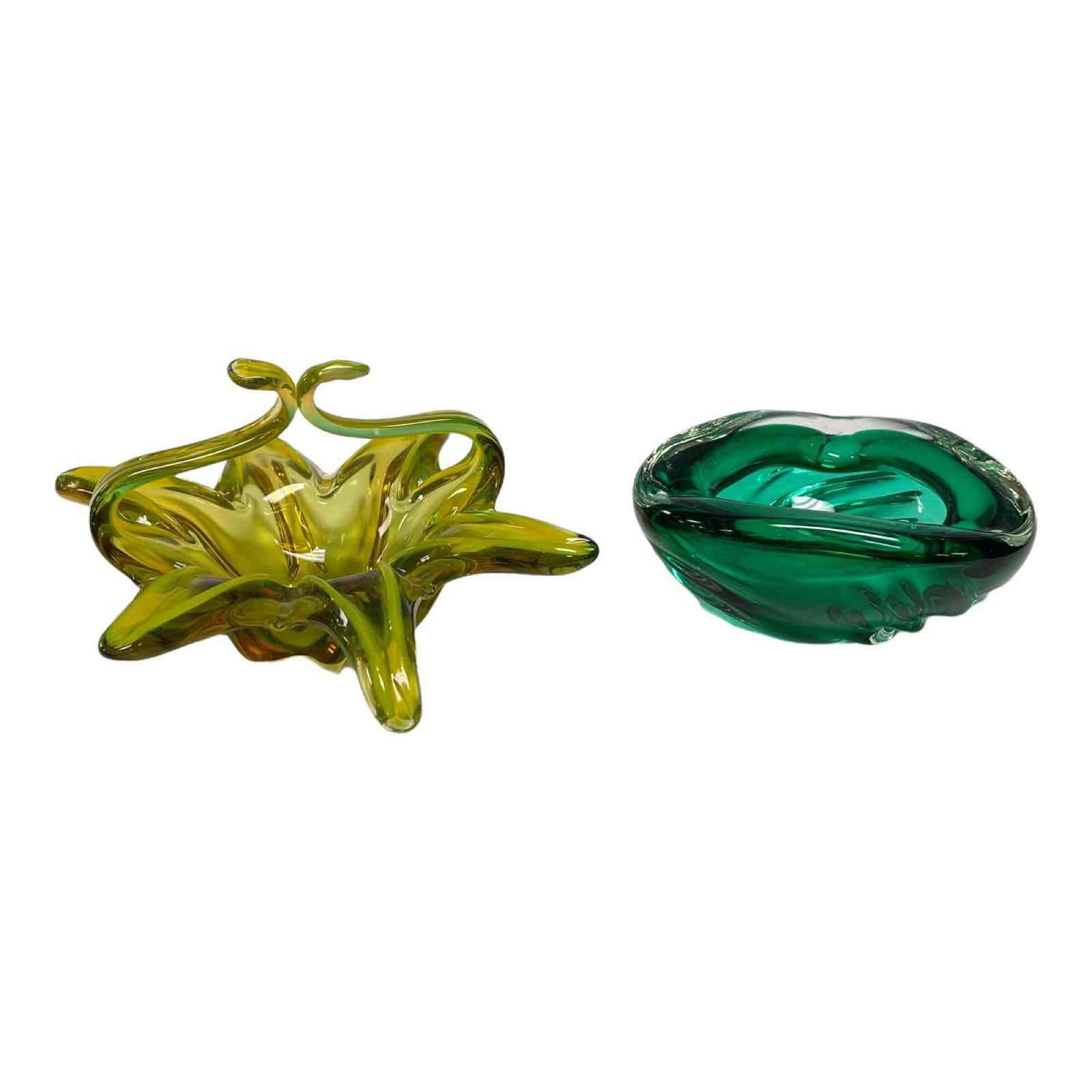MCM Art Glass Ashtray and Basket (2): Includes thick green art glass ashtray and contemporary yellow with amber art glass basket. Measuring approx. 12" at widest on basket and 6.5" at widest ashtray. In good age appropriate condition, see