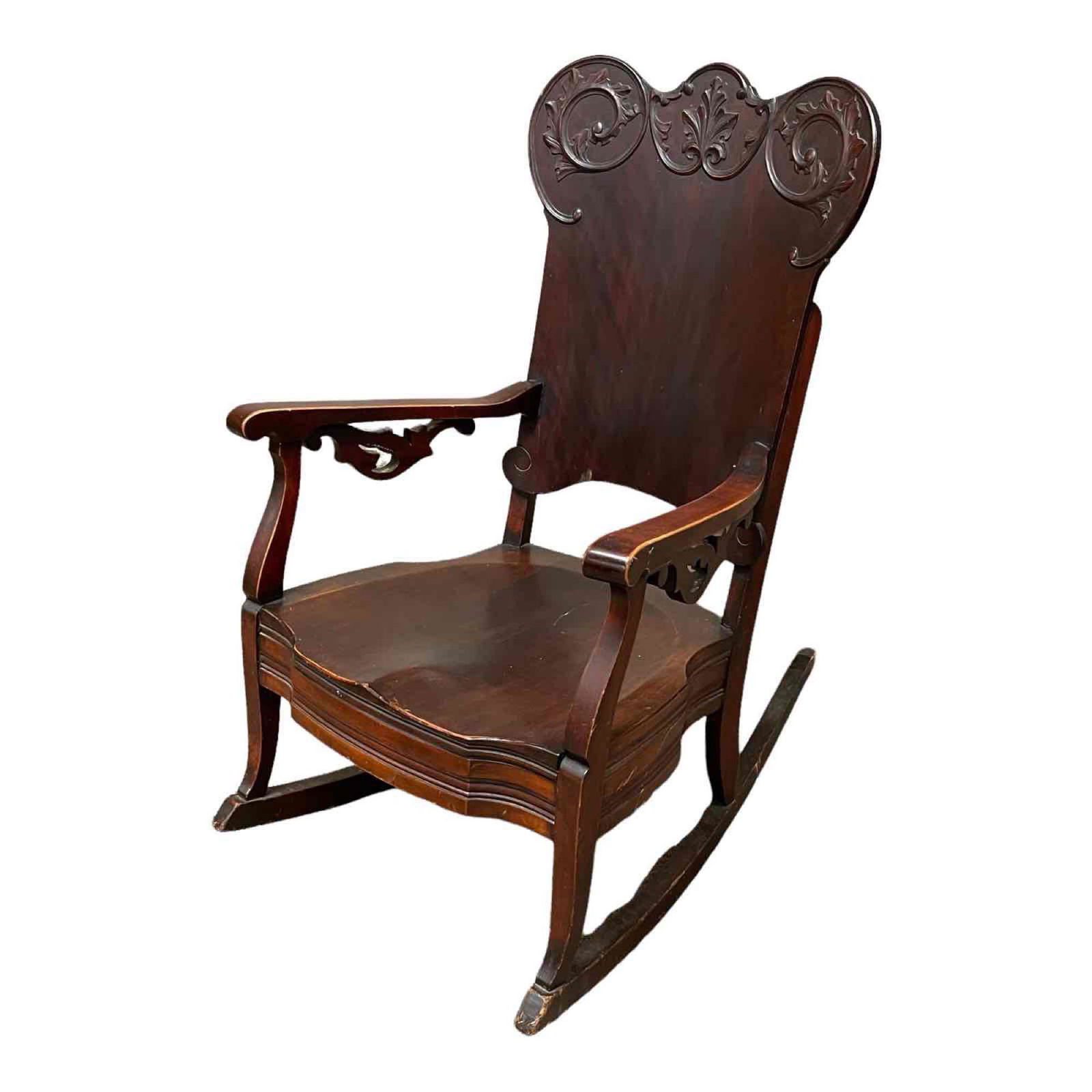Carved American Empire Mahogany Rocking Chair: 19th century Empire Victorian transition period rocker with scalloped carved crest and laminated back. Scuffs and wear as shown, see photos for details.