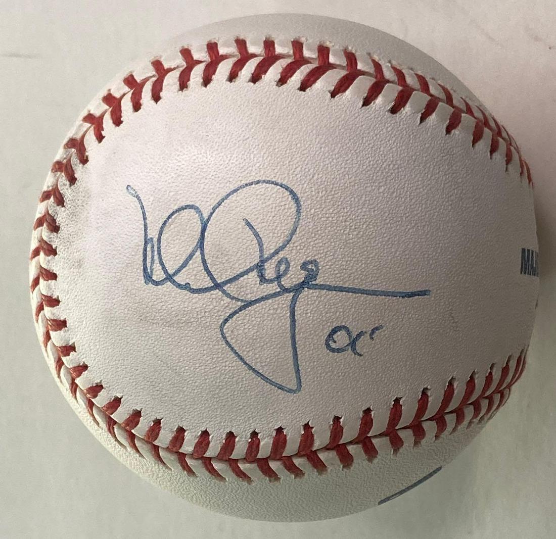 Mark McGwire Autographed Baseball: Official Bud Selig baseball signed on the side panel in blue pen by the super slugging member of the 500 HR club. Also an inscription as McGwire commonly did - appears to be 00' or 01" which would be