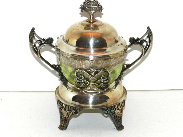 Ornate Victorian SP Server with Vaseline Glass: With detials of aesthetic movement handles, finial and frame, bird decorated legs and lined with cats eye vaseline glass insert. Approc 12"" x 10" wide. Good condition.