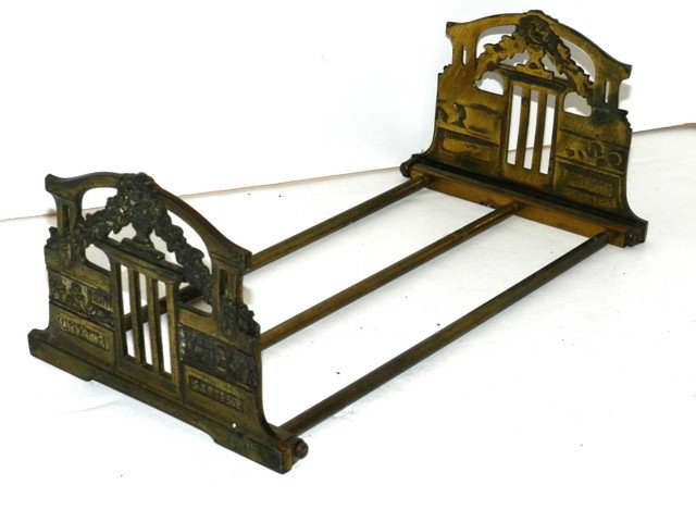 Adjustable European Brass Bookend: With collapsing end and teleoscopic frame. Condition is age appropriate.