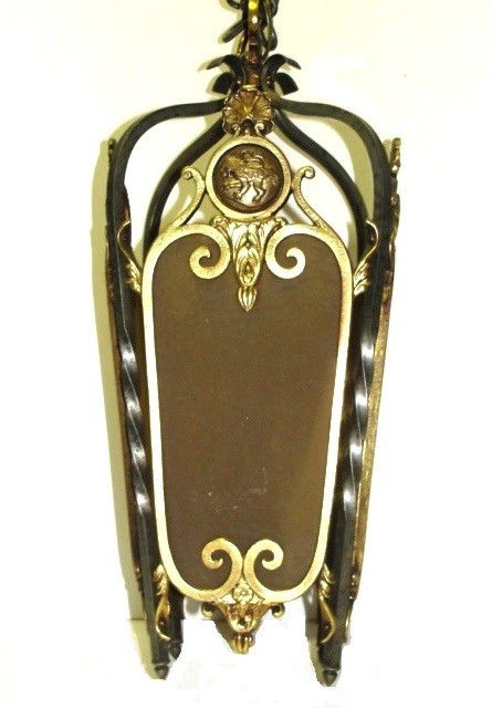 Art Deco Brass And Iron Hall Light: Having four amber glass panels surrounded by ornate brass frame attached to twisted iron post.