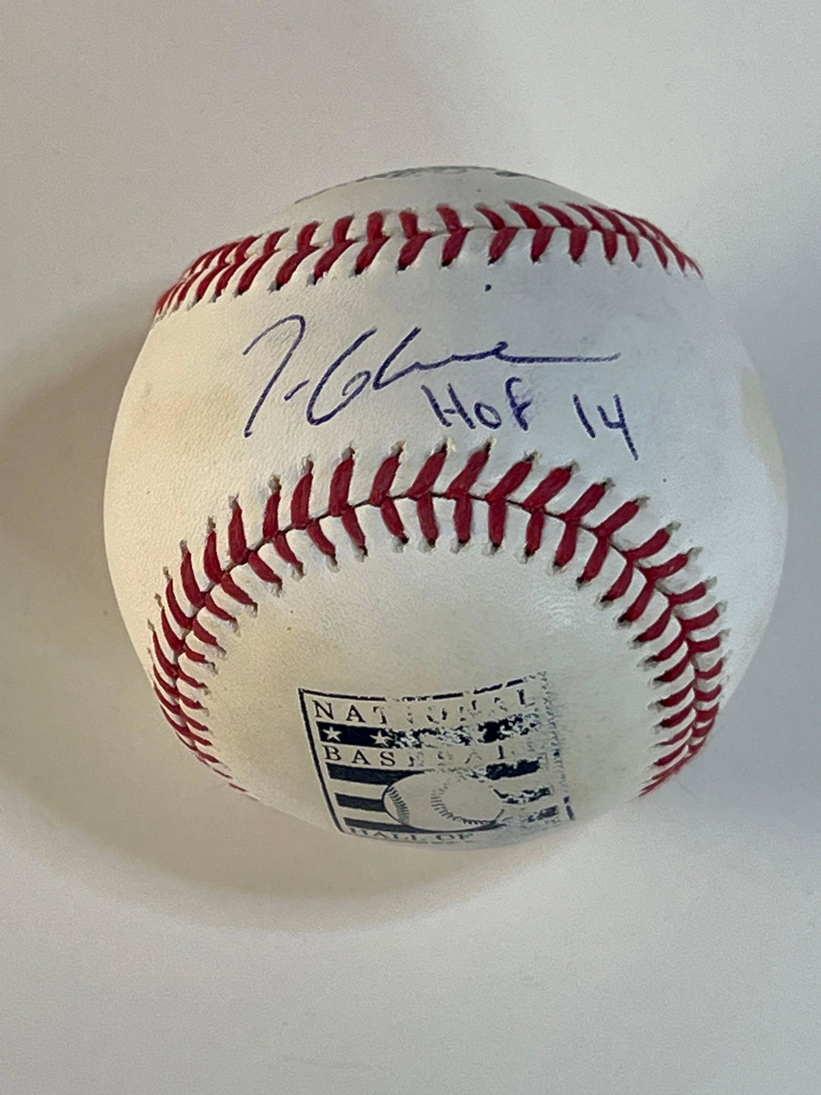 Tom Glavine Signed and Inscribed HOF Baseball JSA: Official Bud Selig baseball with Baseball Hall of Fame logo. Blue pen signature and "HOF 14" inscription on the sweet spot. Slight smudge in signature. Some of the print on the baseball is worn off. J