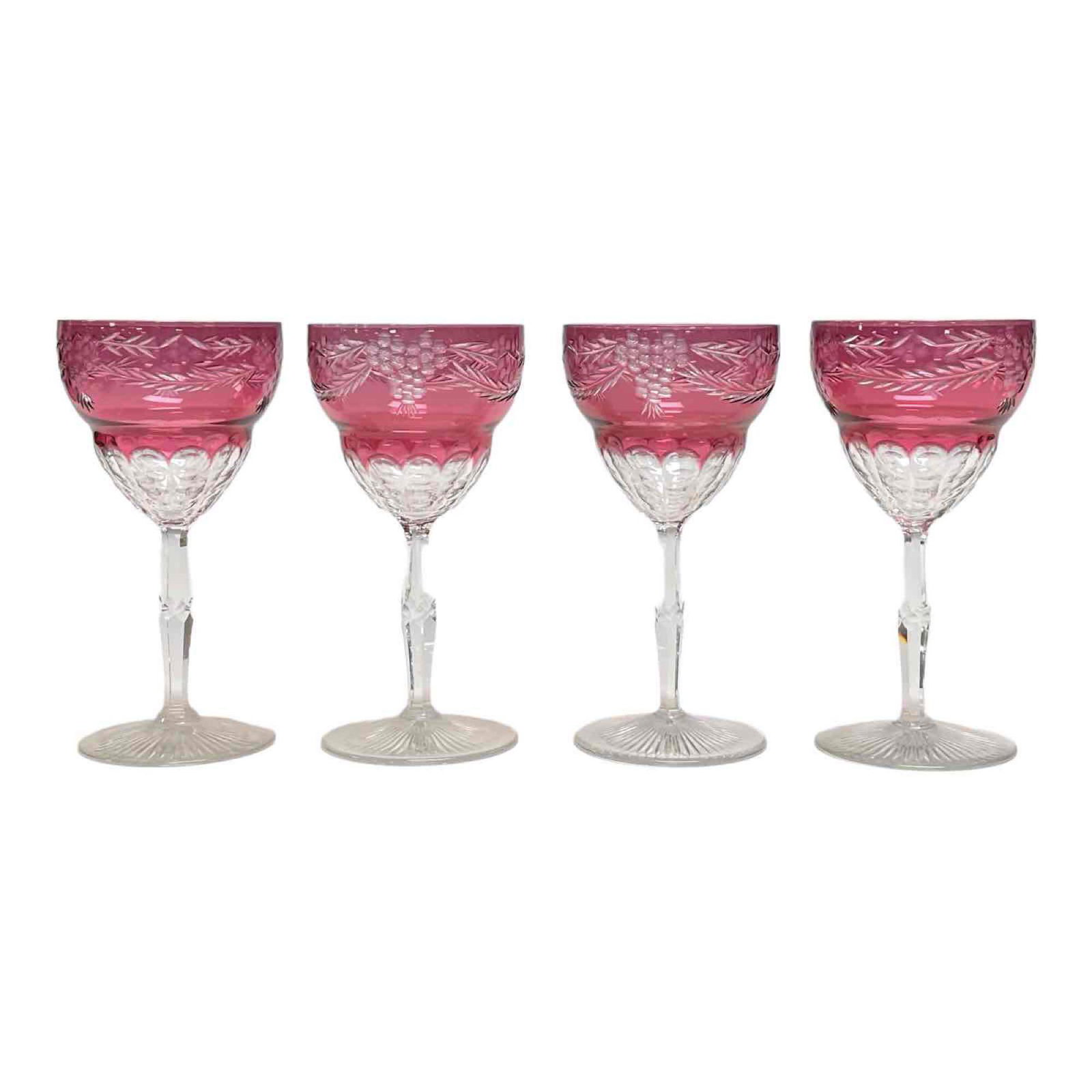 Four Cranberry Cut to Clear Wine Stems: Four cranberry cut to clear crystal wine stemware glasses. Measuring approx 7" tall x 3.5" diameter. Good condition as shown, some light dust soil.