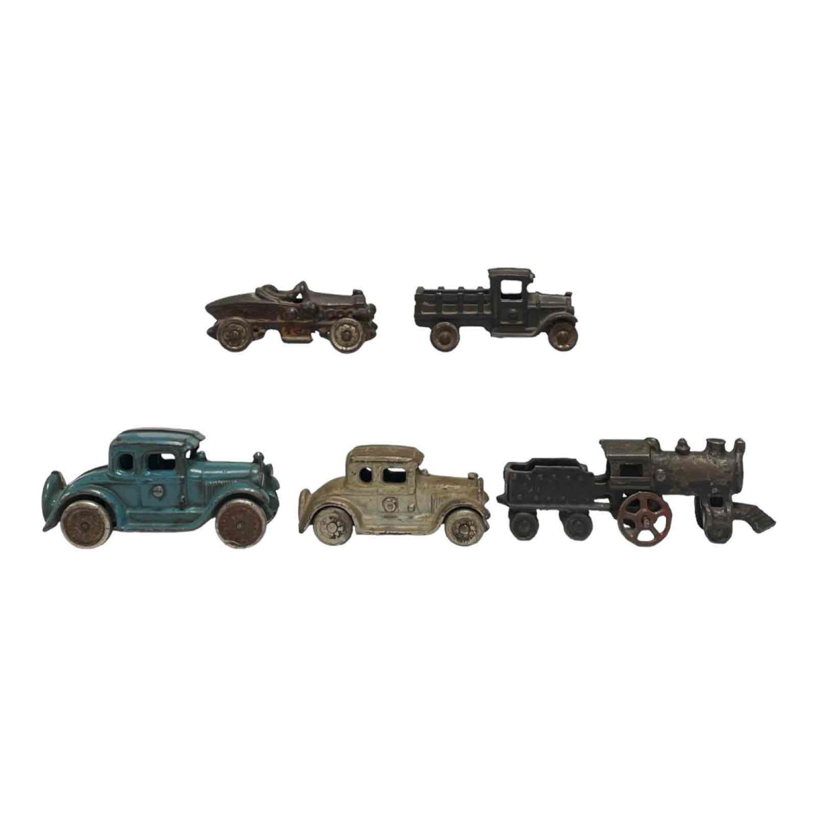 Lot of 5 Vintage Cast Iron Arcade and Other Toys: Lot of 5 cast iron toys from arcade and other unknow makers. 2 Model T, a Roadster race car, Side board flatbed truck and an old steam engine train. see photos for condition.