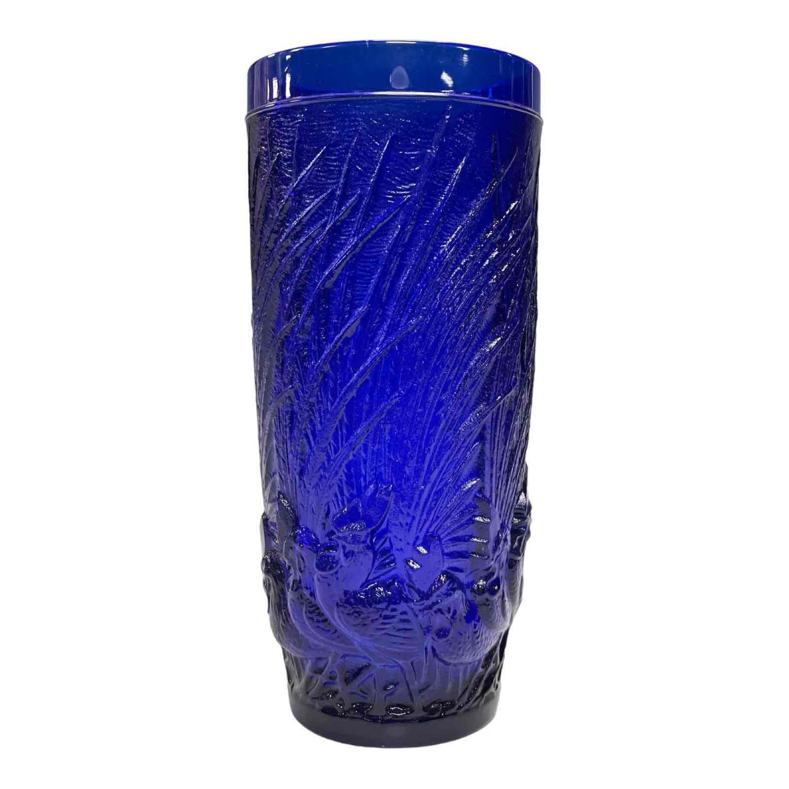 Cobalt Coqs Et Plumes Vase After Rene Lalique: Raised relief cobalt blue glass vase with roosters marching through tall grass. Measuring approx.8" tall. In good condition with a few chips to raised rig, see photos.