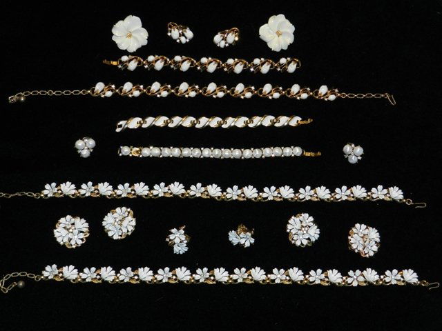 17pc Vintage Trifari Jewelry Lot: Including 2 matching sets white flower sets with center clear rhinestone blossoms (one set also has additional earring), 3pc matching set with bracelet, necklace and earrings, 3pc round pearl style se