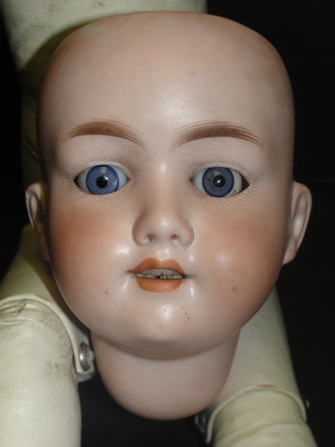 Armand Marseille # 390 Bisque Head And Body: German made doll that has kid body. Condition doll head is off body and in good condition, eyes are loose need glued back inside head, has lower part of arms, missing upper parts. Head visibly marked 