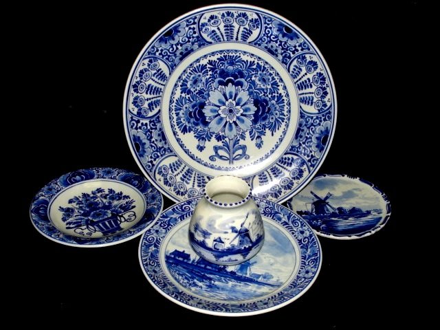 Collection Late 20th. C. Delft Holland Pieces: Including 4 plates Dia. 9'', 7'' 51/2'', 4 1/2'' and 3'' vase. Condition all very good no chips. From Harding Estate