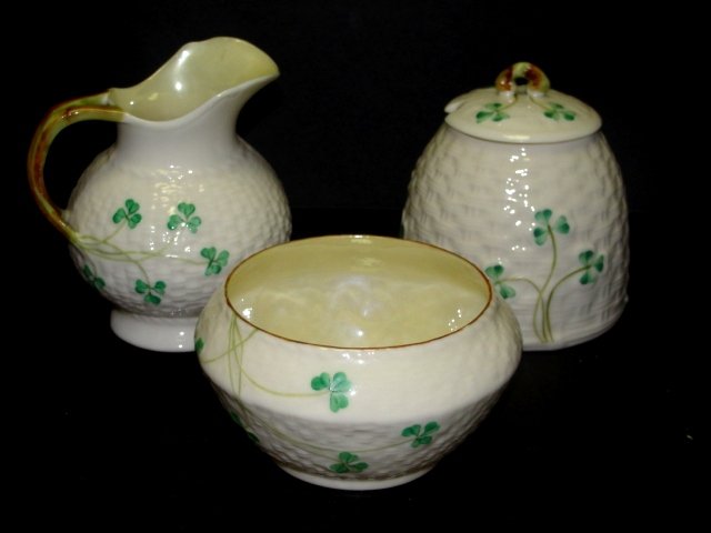 Belleek Cream, Sugar And lidded Honey Pot: All in mint condition. Honey Pot 3 1/4'' tall, creamer 3 1/2'' tall, open sugar bowl 2'' tall. Harding estate.