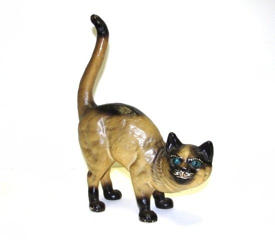 Cast Iron Cat Still Bank / Doorstop Ca. 1950's: In crouched Scary Halloween Stance. Great casted still bank with nice painted colors of dark beige and black. Condition very good. H. 10'' to top of tail, 8'' Long.