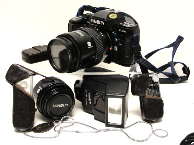 Minolta 7000 Series Camera With Attachments: Condition some fading on one end, untested, appears to be in good working order. See photos for all attachment serial numbers.