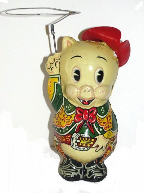 Tin Marx Porky Pig Cowboy Wind-Up Toy: Working. Marked "Cow Puncher Porky" on rear of toy and "1949 Leon Schlesinger". Original lariat and plastic hat. Some overall minor scratching and wear. Condition (Very Good). Size 8" T.