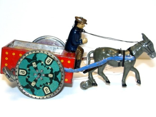 Lehman Tin Litho Wind-Up Donkey Cart NA-OB: Made in Germany. All original ca. 1930's. Good graphics. Condition very good, working with moderate scratches. L. 6''.