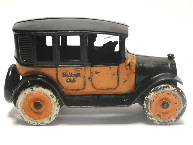 Arcade Yellow Cab With Driver Cast Iron Toy: Classic toy is totally original including the driver, grill screen, axles and wheels. Wheels have noticeable paint loss. The rest of the toy has minor paint loss and some scratching. No cracks or repa