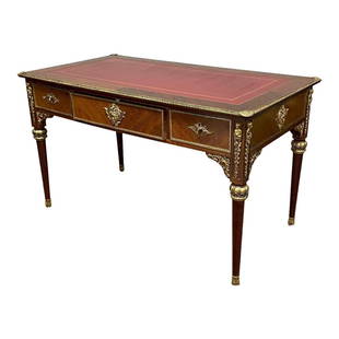 French Louis XVI Style Ormolu Desk with Leather Top: French Louis XVI Style Ormolu Desk with leather top, bronze figural mounts and accents throughout. A Napoleonic style French desk. Overall condition is.Measuring approx 52" wide x 28.5" deep x 30"