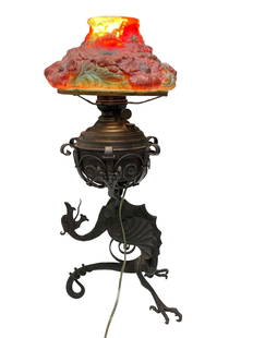 Winged Griffin Gargoyle Oil Lamp with Puffy Shade: Early American cast iron winged griffin oil lamp base converted to electric with puffy art glass shade. Measuring approx 28" tall and a 10" diameter (fitter) shade. Working condition as shown, see pho