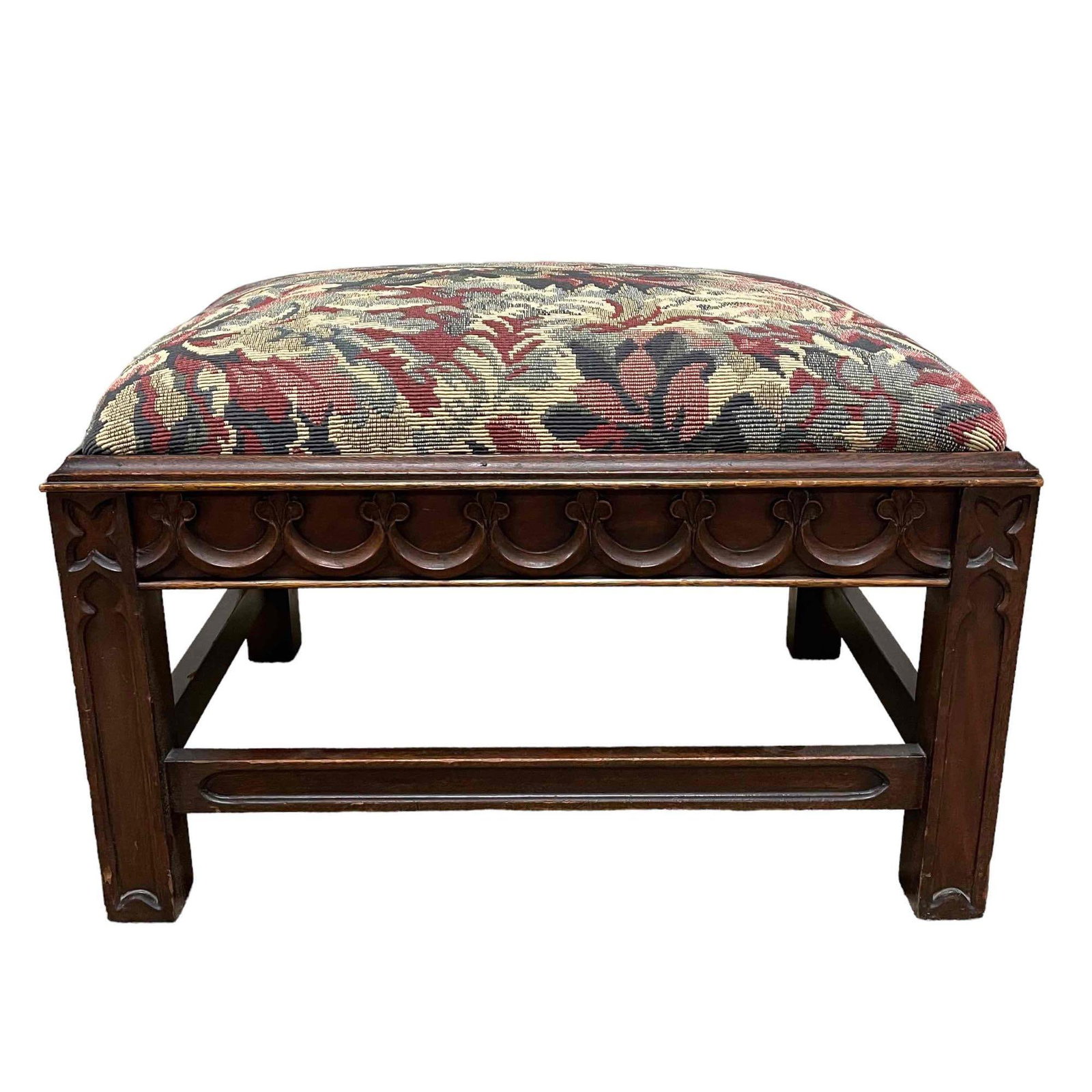 19th Century Gothic Revival Carved Hassock: Fine quality 19th century carved walnut and Mahogany ottoman or foot rest. Updated upholstery as shown. Measuring approx 24" x 19" x 15" tall. Good condition as shown, see photos