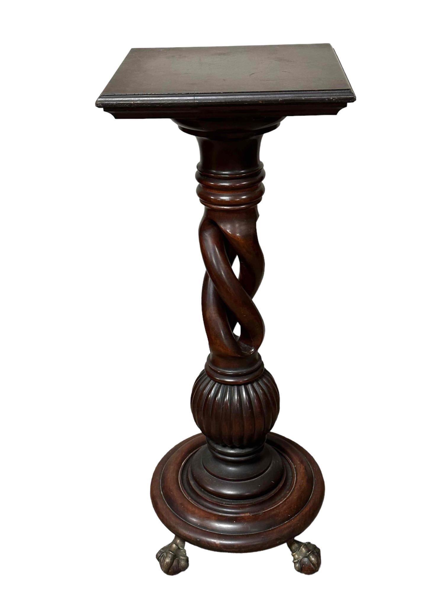 Merklen Brothers Mahogany Pedestal: A fine, 19th century, American, New York Merklen Brother Furniture open spiral craved mahogany pedestal stand on wood ball and brass claw footed base. Measuring approx 35.5" tall x 14" x 14" top surfa