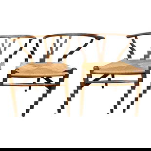 Wishbone Designed Chairs By Carl Hansen and Son: Pair of curved back teak and rush. The Danish mid century design by Hans Wegner by Carl Hansen and Son Manufacturers stamped to underside as shown. Some light scuffs as shown, see photos. Measuring ap