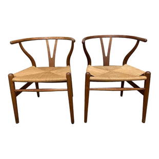 Wishbone Designed Chairs By Carl Hansen and Son: Pair of curved back teak and rush. The Danish mid century design by Hans Wegner by Carl Hansen and Son Manufacturers stamped to underside as shown. Some light scuffs as shown, see photos. Measuring ap