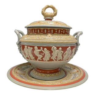 Antique German Mettlach Tureen and Underplate: A 19th century German tureen of low baluster form, with lion mask handles, decorated with a continuous band of figures celebrating. Castle mark Mettlach No.2087 Punch Bowl or lidded tureen and under t