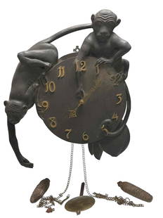 Rare Waterbury American Oak Monkey Wall Clock: Rare antique Waterbury carved American oak monkey wall clock. Depicting two playful carved monkeys around cylindrical dial face case. Measures 22" tall x 18-1/2" wide. Clock is missing the key, but is