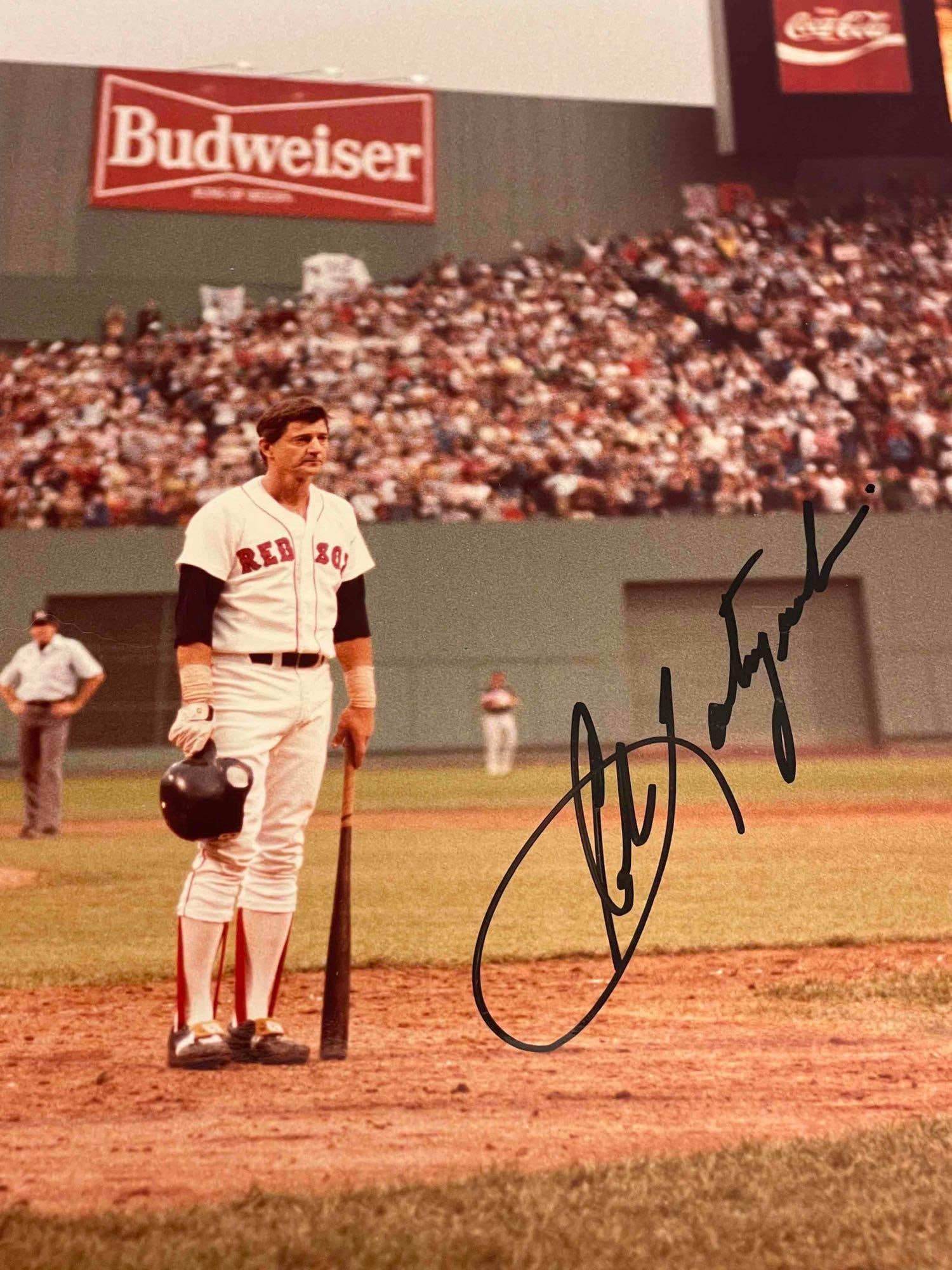Carl Yaztremski Autographed 11x14 Photo Last At Bat JSA: Color image of Yaz standing to an ovation during his last game - the final game of the 1983 season against the Indians. Black marker signature by the Boston icon. JSA certified.