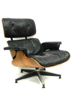 Charles Eames for Herman Miller Chair: Charles Eames Rosewood designed 1956 chair, bearing circular metal Herman Miller label and paper label, molded shell with black leather upholstery on aluminum frame. Condition is good although seated