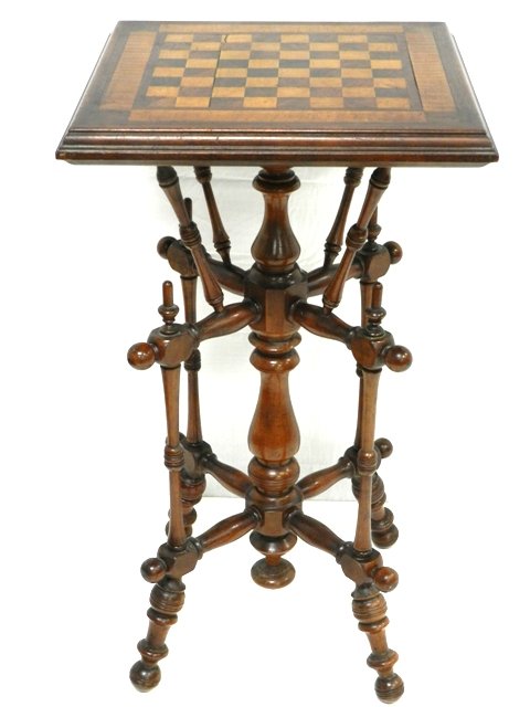 American Cherry Victorian Games Table: Victorian cherry wood games top stand. Unique size and victorian designed base. Approx 29" with 16" x 16" game top. Condition is good. Ca. 1870