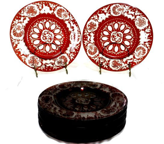 12 Bohemian Ruby Cut To Clear Dinner Plates: 12 Bohemian ruby to clear dinner plates with stags and other wildlife through out as well as scenic castle scenes. One plate also with dog center motiff. Plates are assembled not identical match. Flas