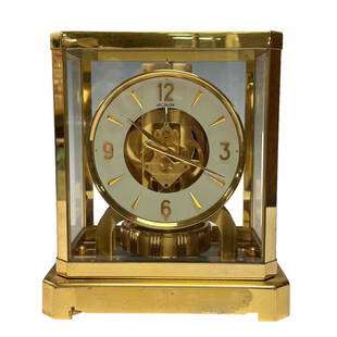 Le Coultre Atmos Perpetual Motion Clock: Le Coultre vintage Atmos perpetual motion brass and glass clock, number 160689, marked. Fifteen 15 Jewels VXN Switzerland Unadjusted. Measuring approx 9" H x 7.5" W x 5.5" D. Good working condition as