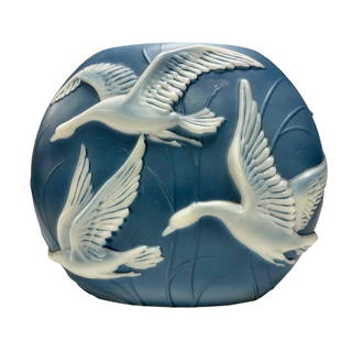 Phoenix Glass Art Deco Geese in Flight Pillow Vase: A fine early 20th century Art Deco consolidated art glass pillow vase with sky blue hue and frosted white geese in flight raised relief motif. Measuring approx 9.5" tall x 12" wide x 5" deep. Good use