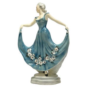 Art Deco GOLDSCHEIDER Dancing Lady Figurine: Artist signed 1930's era ceramic figurine of Art Deco dancing woman with blue floral dress. Stamped on bottom of base as shown with artist signature. Measuring approx 15.5" tall x 10" wide. Note, ligh