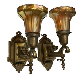 Pair of French Art Deco Style Bronze Sconces: A fine pair of bronze single arm wall sconces with ribbed quezal style aurene shades. French art deco style measuring approx 12" tall x 10" deep off the wall. Condition ig good, as shown, see photos f