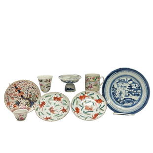 Eight Piece Chinese Porcelain Group (8): Various Chinese porcelain including; two goldfish saucers. Imari short bowl, blue and white plate, pinming cup with repair, butterfly cup with repair, early tea cup and pedestal soy dish with bats. Se