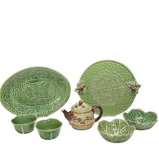 Group of Bordallo Pinheiro Pottery Pcs: Including two smaller 5" dia cabbage bowls (one chipped as shown), two 7" dia bowls, an oval 15" long serving platter and a Strawberry motif serving tray approx 12.5" dia. See photos for details.