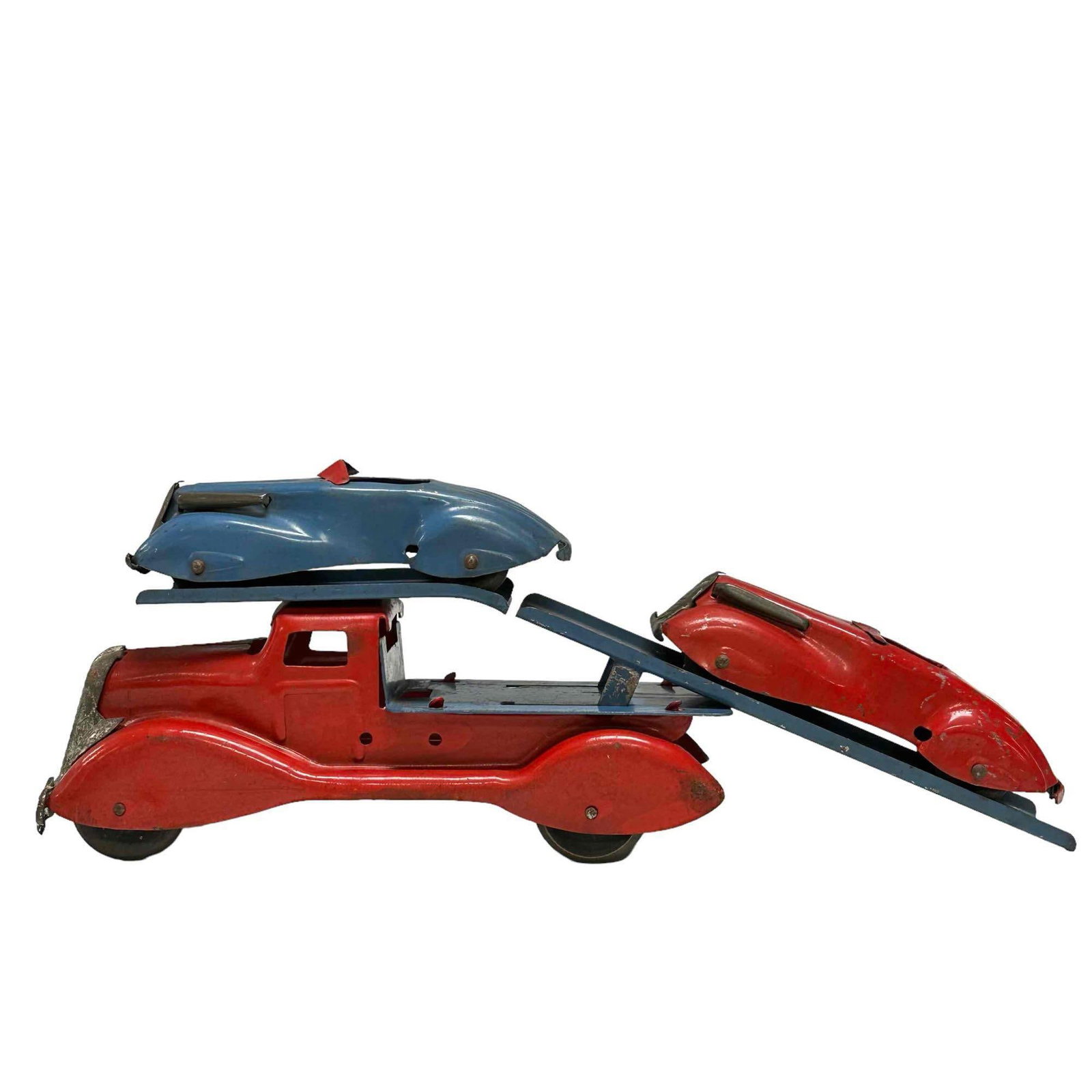Art Deco Car Carrier w/ Cars by MARX: Antique pressed steel car carrier and two cars. Original condition with wear and scuffs as shown. Measuring approx 13.5" in length. See photos