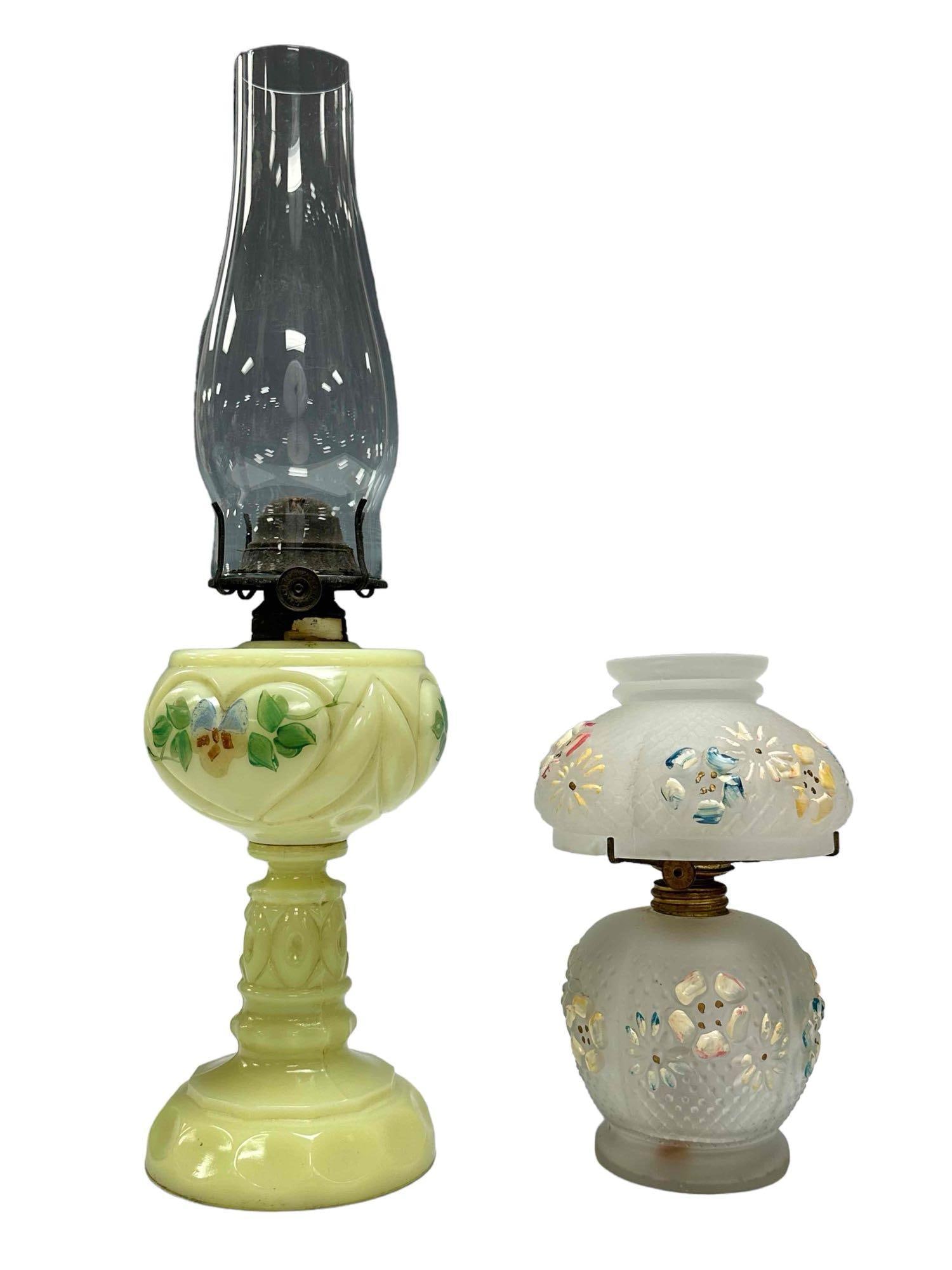 Custard and Frost Glass Oil Lamps: Pedestal custard glass oil lamp with flute and miniature frost glass oil lamp with matching glass shade. Measuring approx. 7.25" to 15.5" tall total. Both in good condition with no breaks, see photos.
