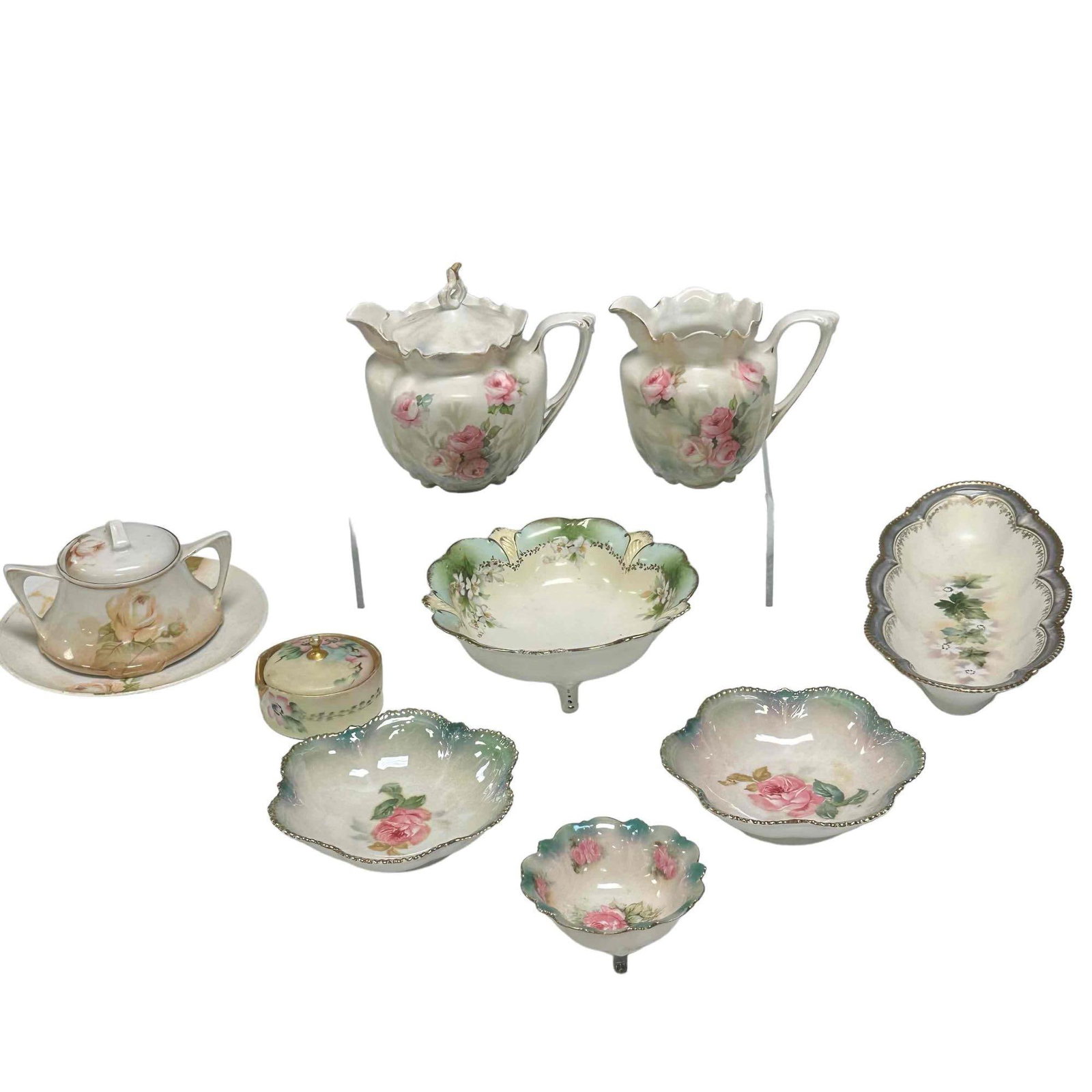 German and RS Prussia Porcelain Group: Including 9.5" relish serving dish, 6" footed bowl, two matching 5" berry finger bowls luster finish, creamer and covered sugar (small rim chip on covered sugar bowl), two small dishes all marked with