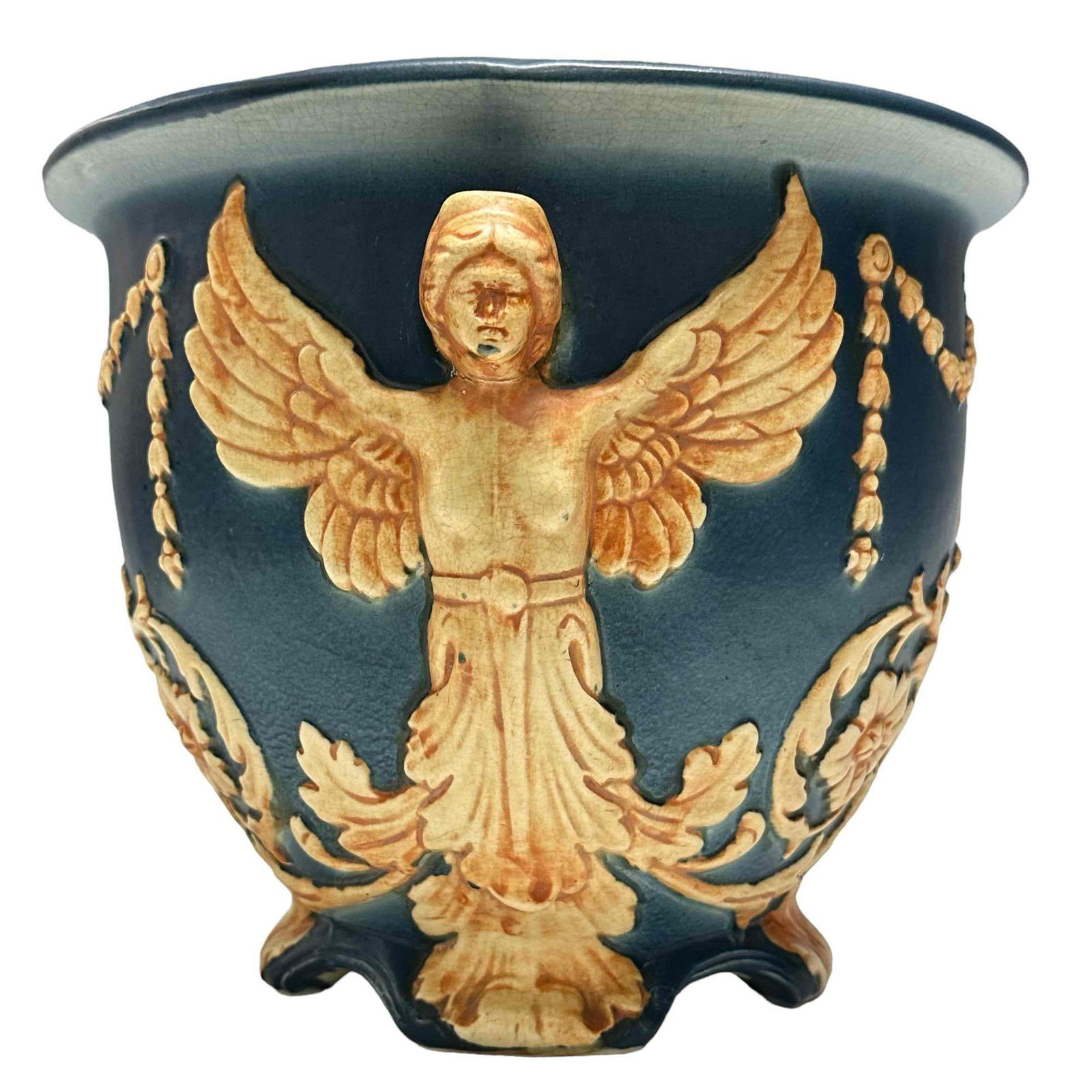 WELLER Blue Ware Pottery Jardiniere: A WELLER BLUEWARE ART POTTERY JARDINIÈRE, early 20th century, with embossed decoration of winged victory, impressed mark. Height 8.75 inches. Repaired as shown, still a wonderful display and useful p