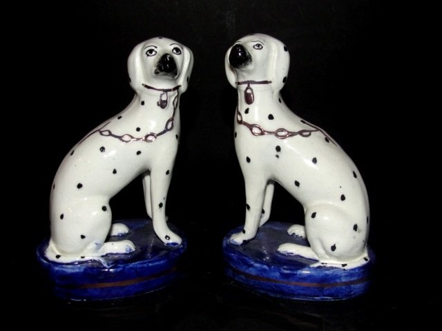 A Pair of Staffordshire Dogs , Marked "England'': Yellow Ink mark '' Old Staffordshire Ware''. each seated on an ovoid cobalt ground plinth, height 5'.' Condition very good